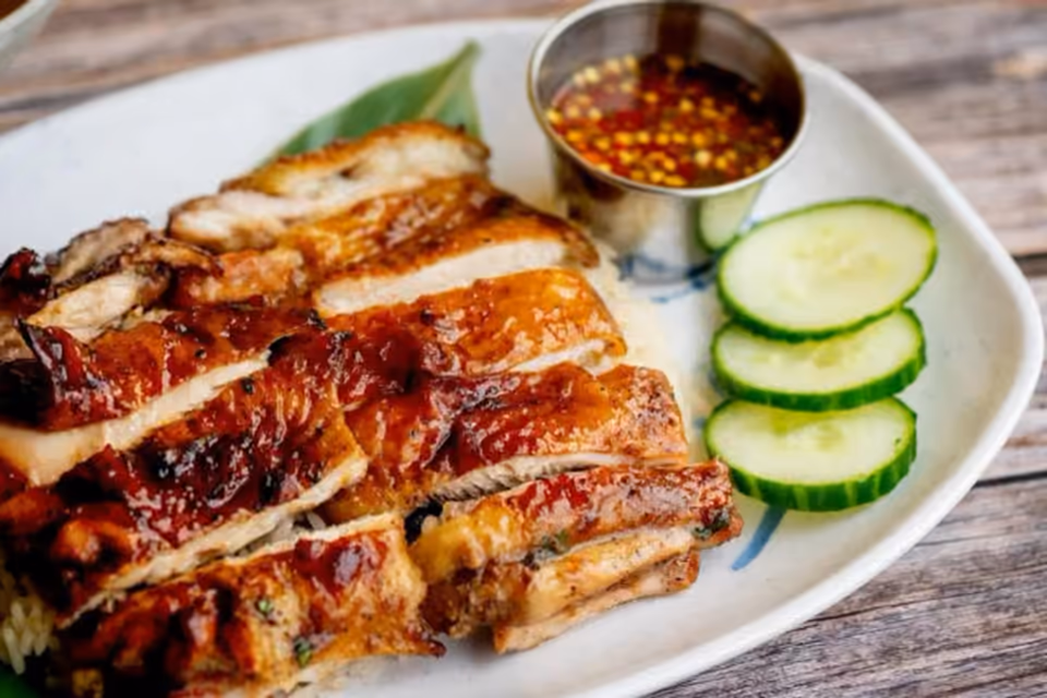 Roasted chicken slices over rice for a shared What Da Chick meal